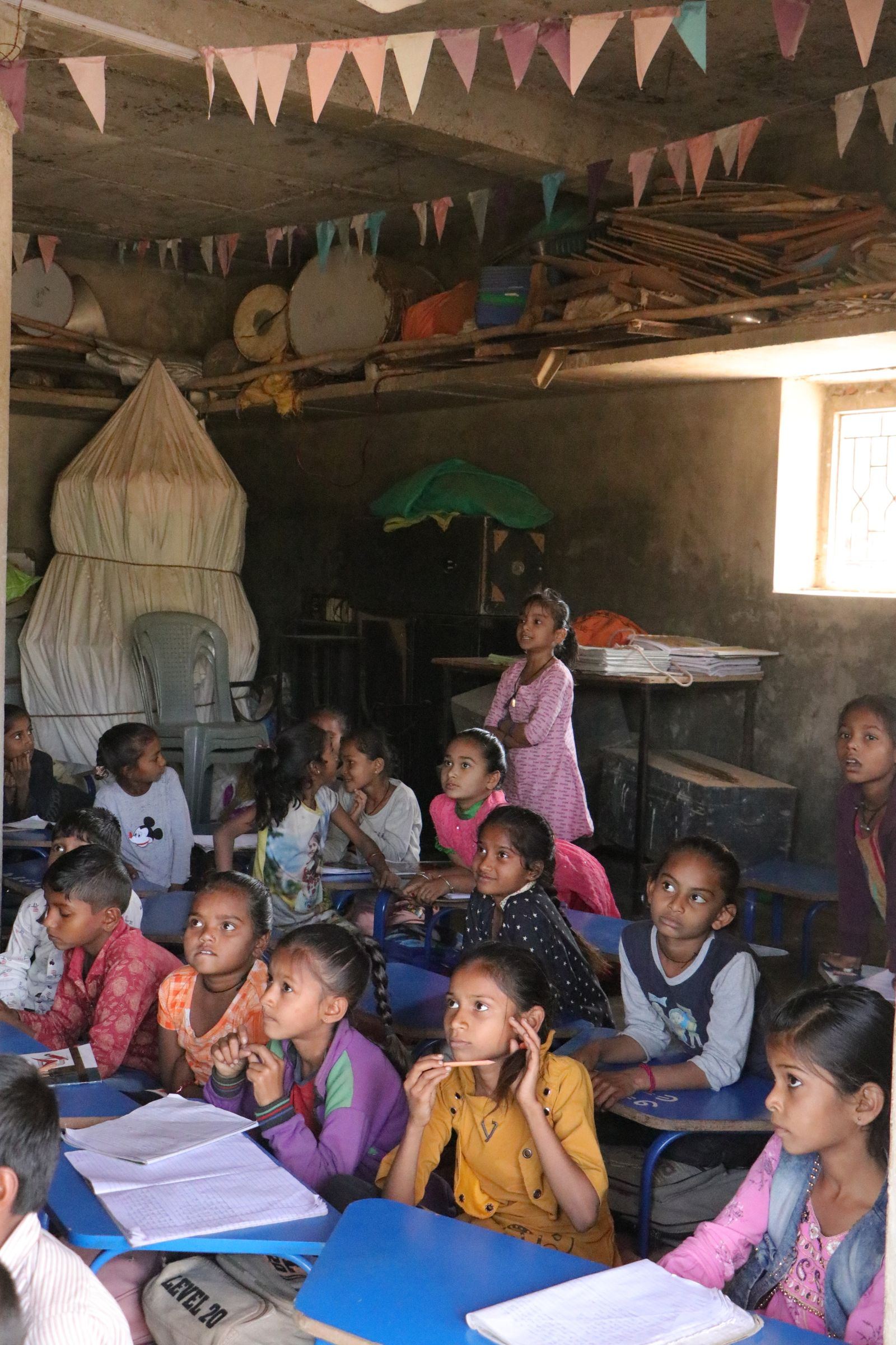 Children learning together in a rural classroom in India